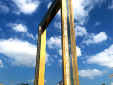 Dubai Frame's golden facade against a blue sky