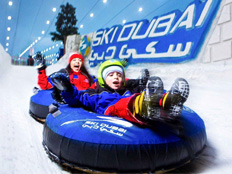 Mother and son on a tube ride at Ski Dubai